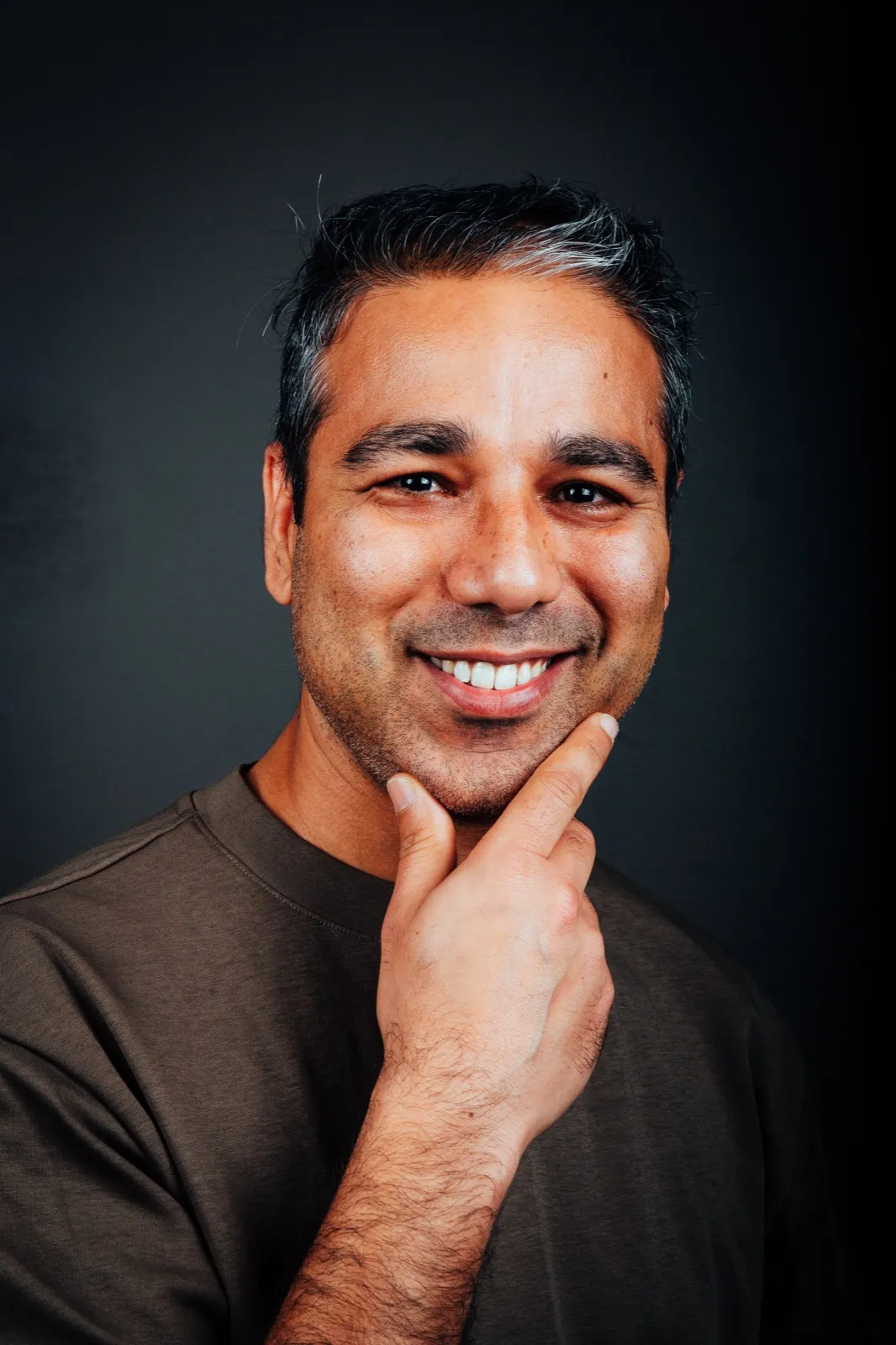Studio portrait of Nischal Tiwari smiling